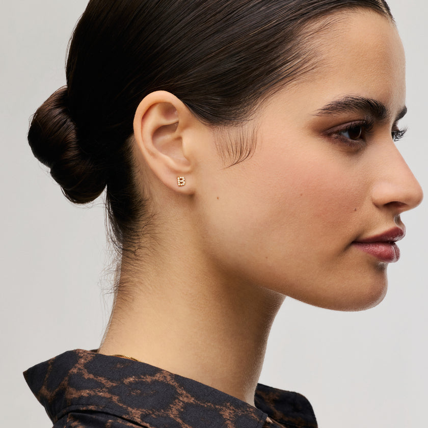 Single abc Stud Earring on model