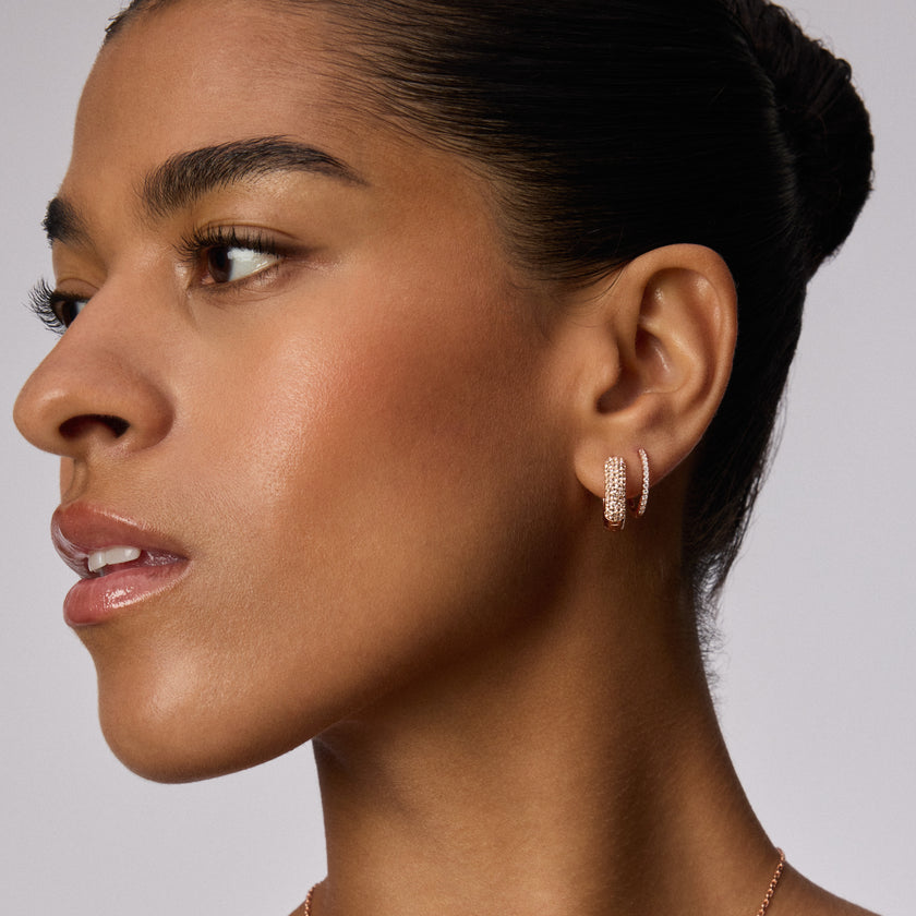 Rose Gold Starburst Sparkle Reversible Hoop Earrings on model