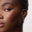 16mm 10k Hoop Earrings on model