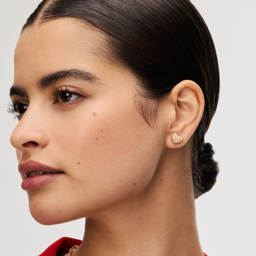 Soft Gold Sparkle Heart Stud Earrings on model