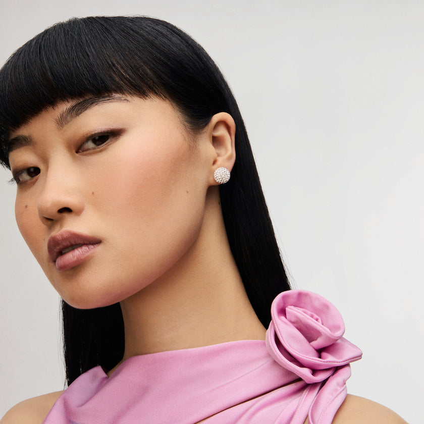 White Large Sparkle Ball™ Stud Earrings on model