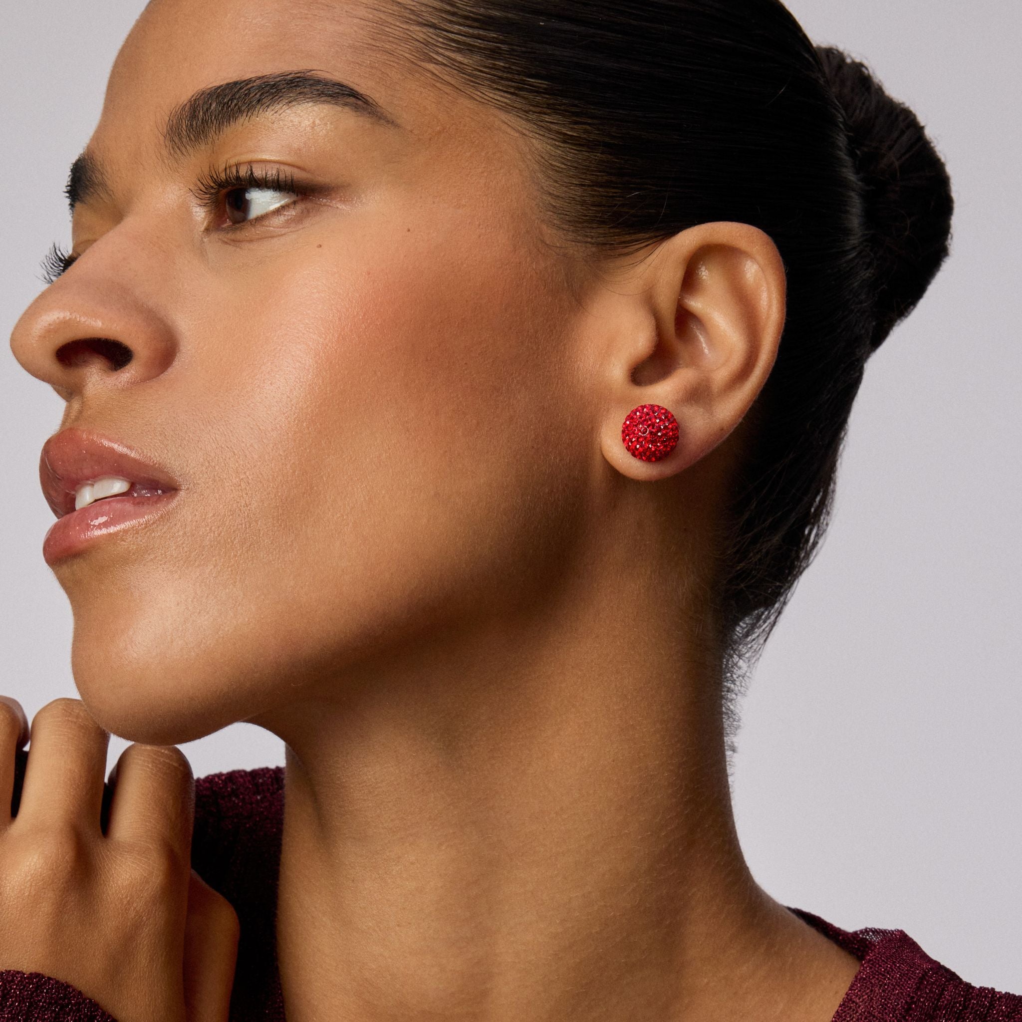 Large Red Velvet Sparkle Ball™ Stud Earrings on model