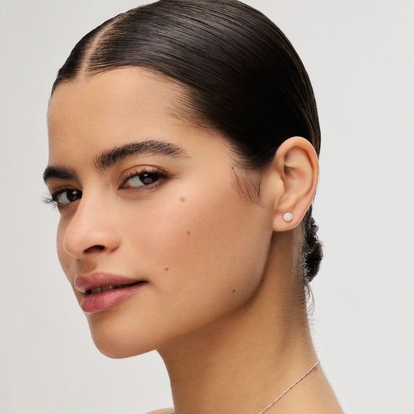 White Mini Sparkle Ball™ Stud Earrings on model