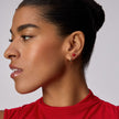 Mini Red Velvet Sparkle Ball™ Stud Earrings on model