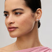 White Sparkle Bezel Stud Earrings on model