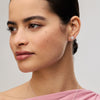White Sparkle Bezel Stud Earrings on model