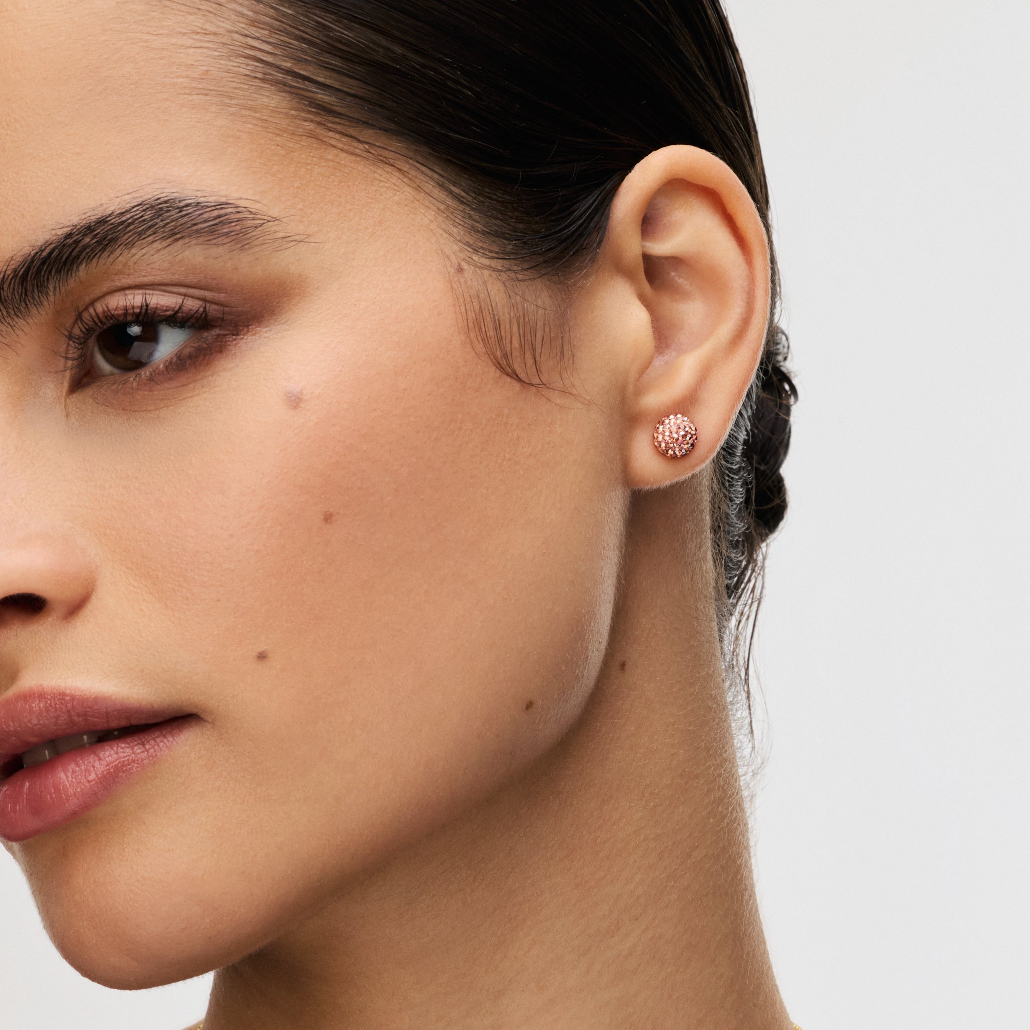 Small Desert Rose Sparkle Ball™ Stud Earrings on model