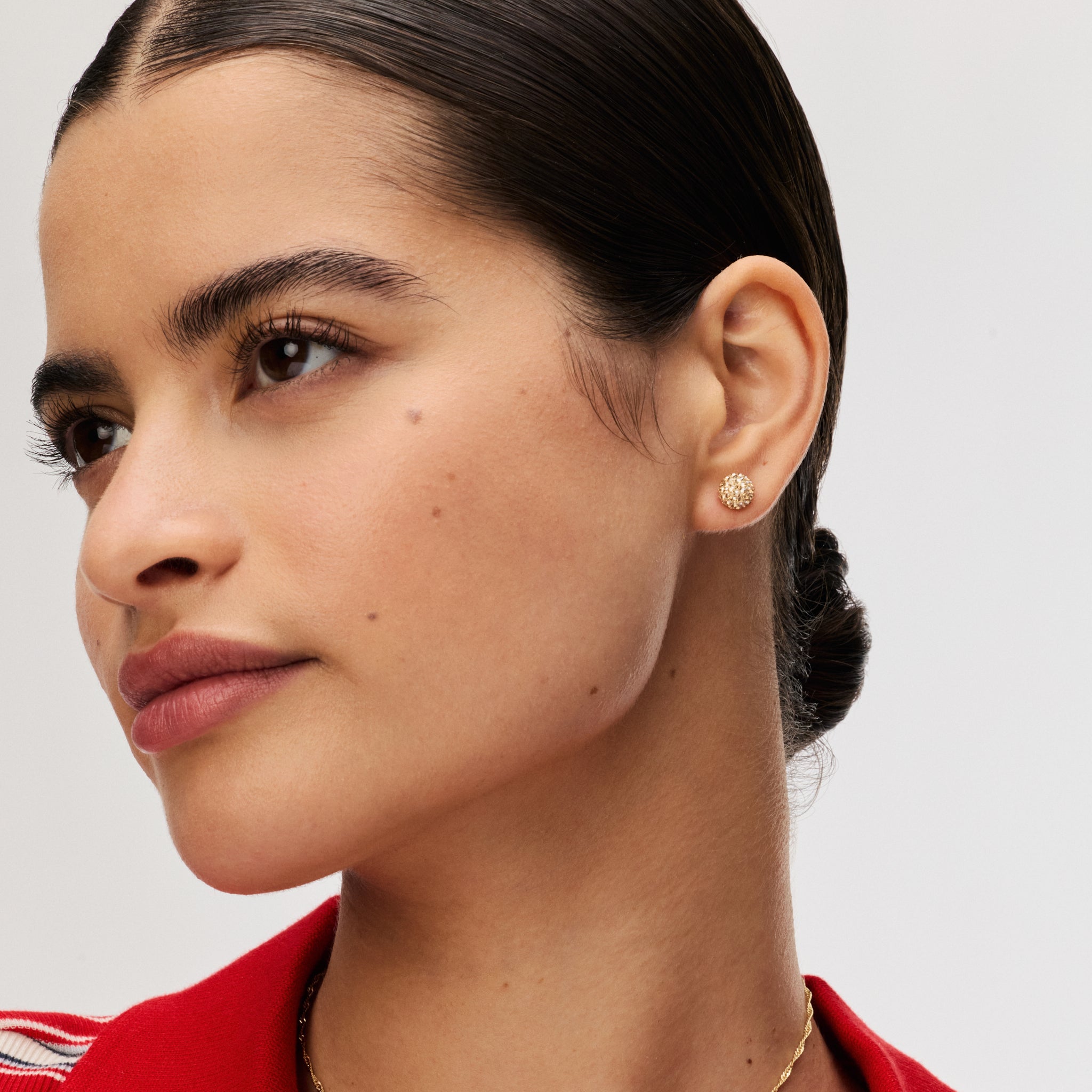 Soft Gold Small Sparkle Ball™ Stud Earrings on model