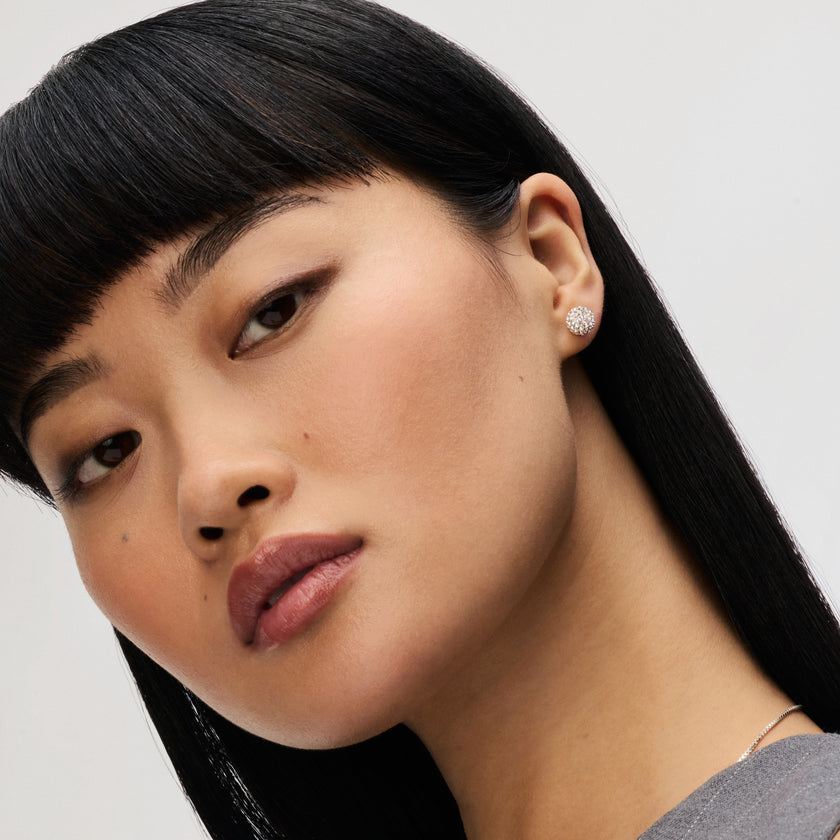 White Small Sparkle Ball™ Stud Earrings on model