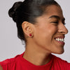 Small Red Velvet Sparkle Ball™ Stud Earrings on model