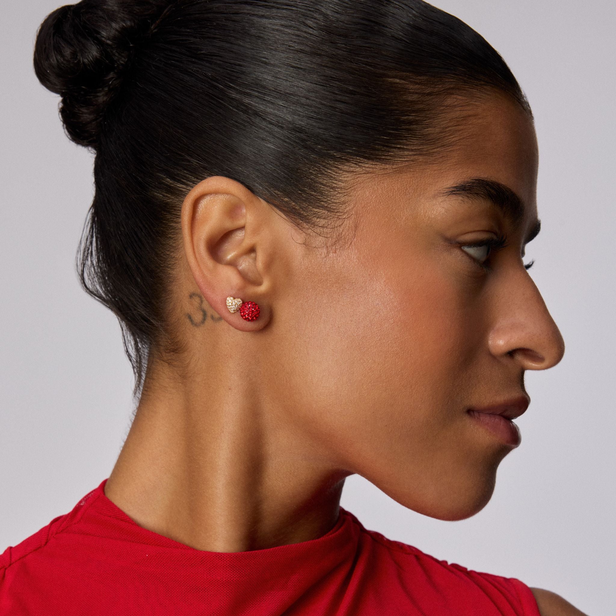 Small Red Velvet Sparkle Ball™ Stud Earrings on model