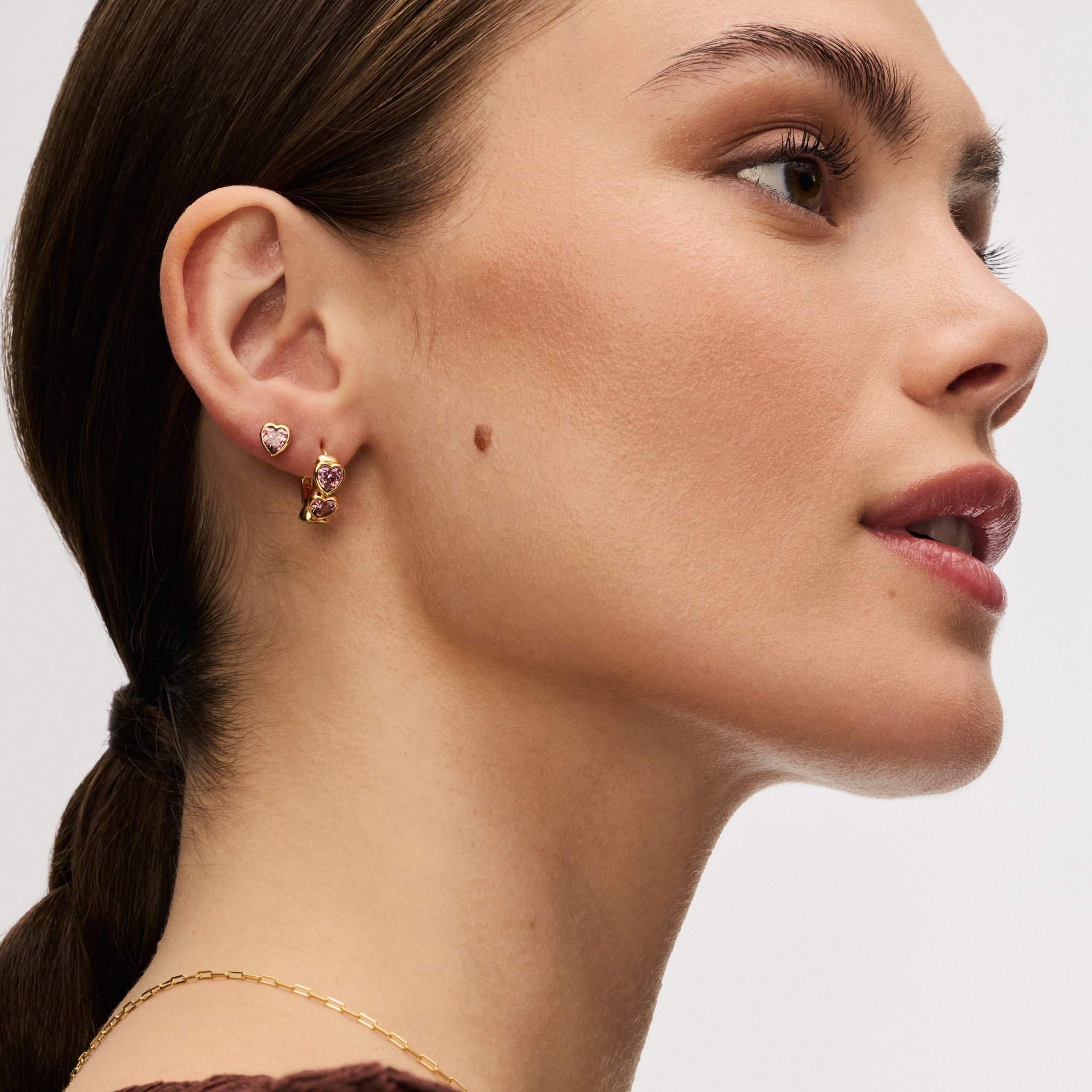 Gold Adore Bezel Stud Earrings and Adore Bezel Stud Hoop Earrings on model