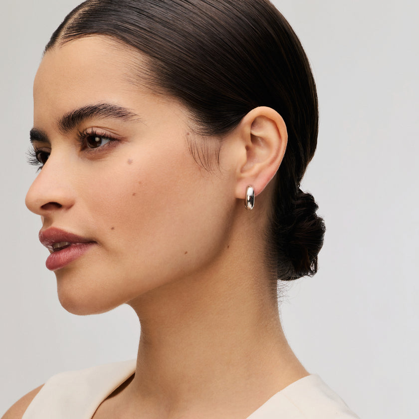 Small Bold Reversible Hoop Earrings on model