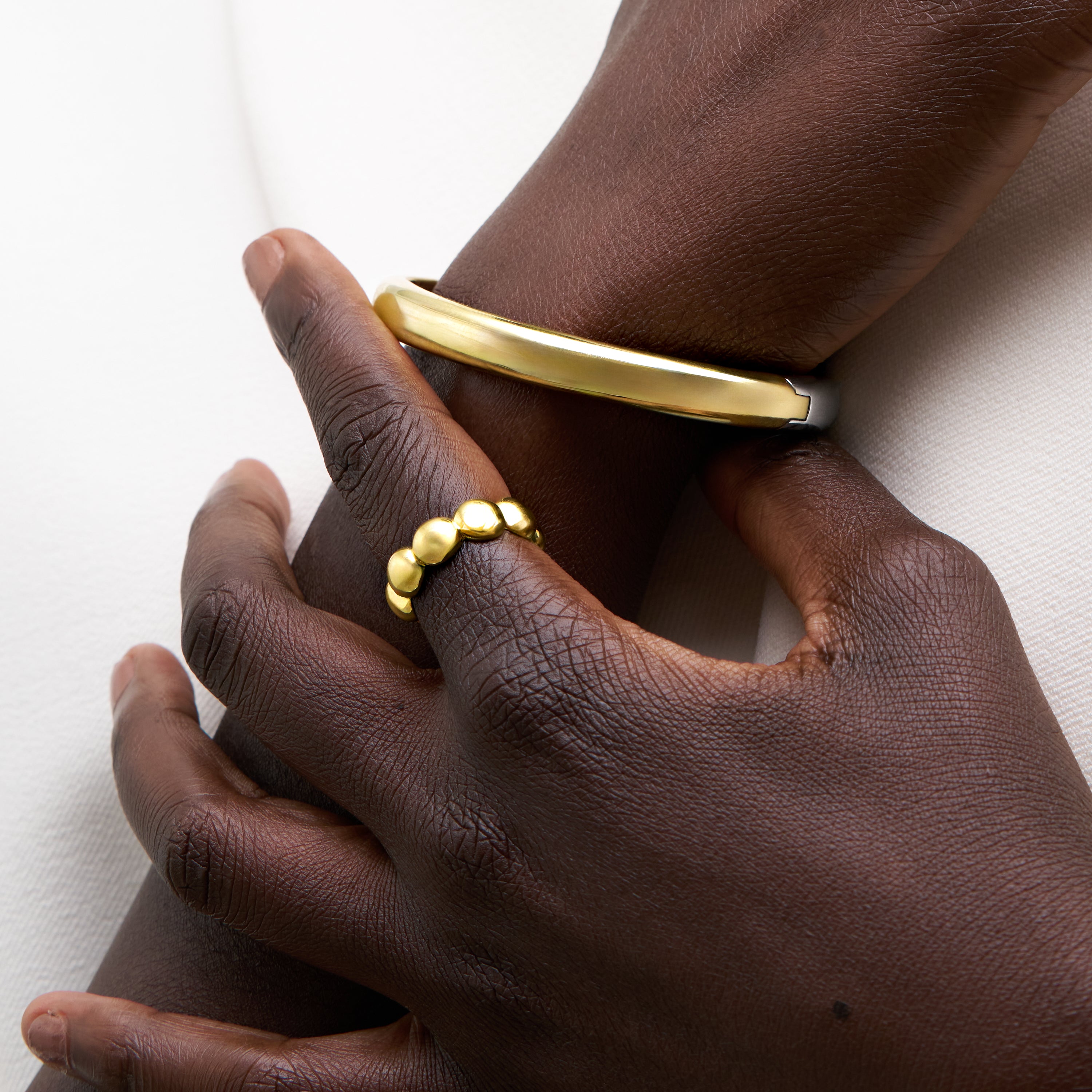 Two-Tone Bangle Bracelet Gold side on model