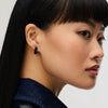 Astral & Black Sparkle Reversible Hoop Earrings on model 