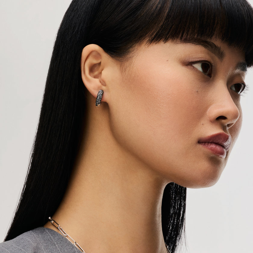 Small Two-Tone Reversible Sparkle Hoop Earrings Hematite Side on model