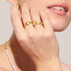 Etched Floral Buckle Ring and Cupid Ring on model