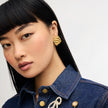 Gold Drift Statement Earrings on model