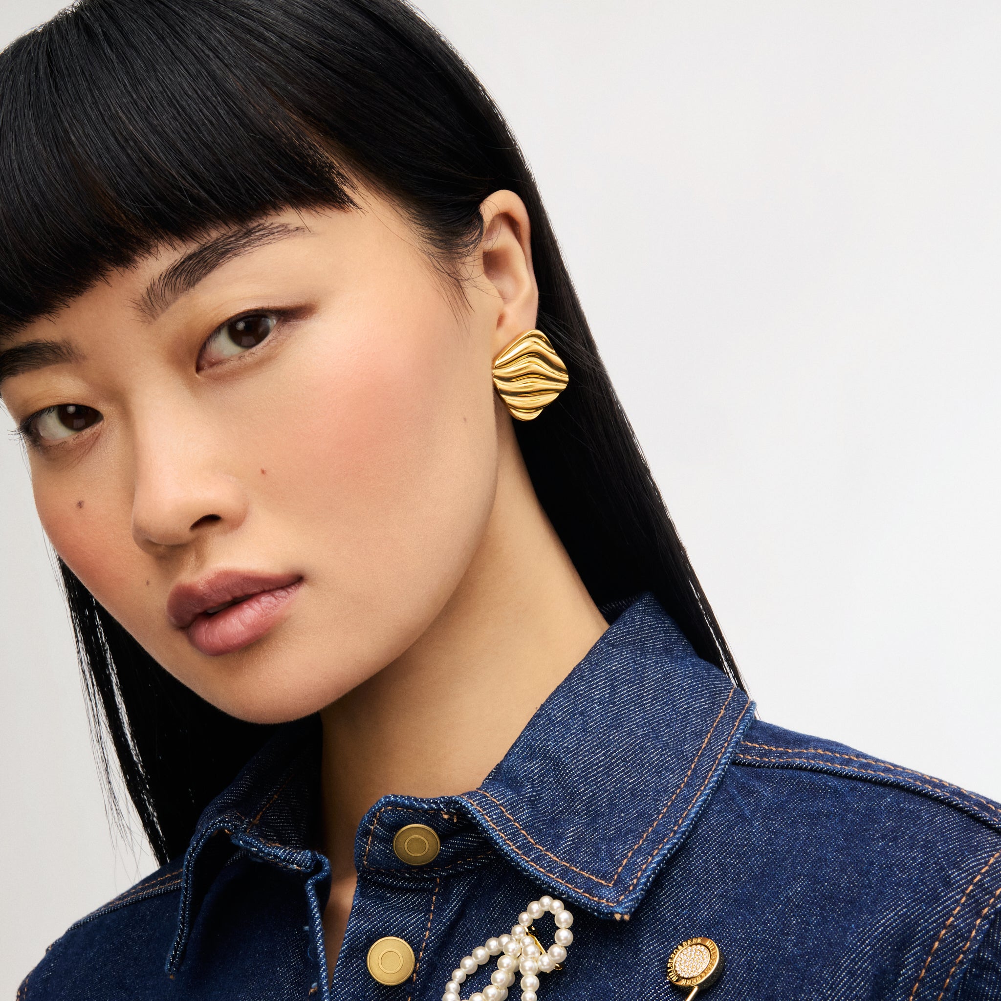 Gold Drift Statement Earrings on model