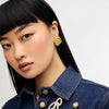 Gold Drift Statement Earrings on model