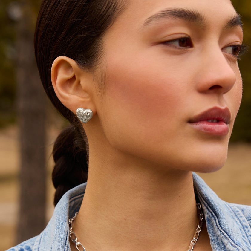 Etched Floral Heart Stud Earrings on model