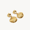 Golden Shell Drop Earrings laying flat