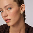 Soft Gold Icon Sparkle Stud Earrings on model
