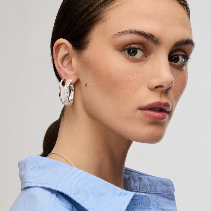 White Large Sparkle Hoop Earrings and Silver Large Hoop Earrings on model