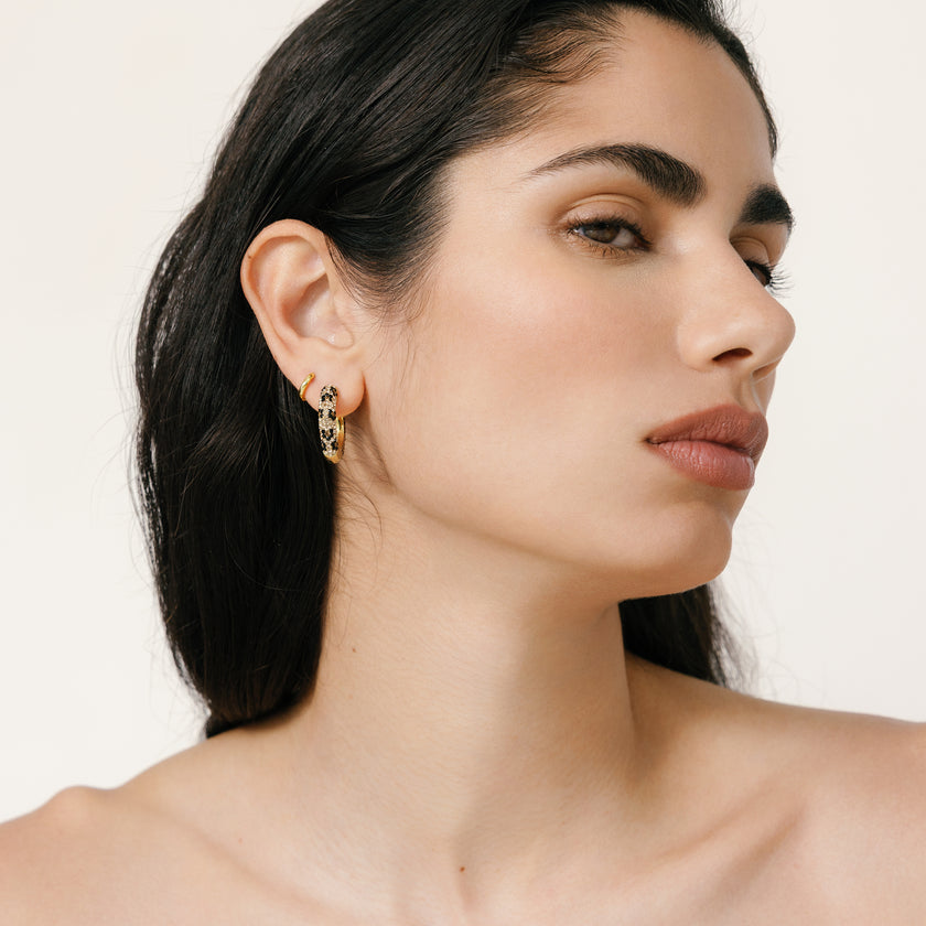 Leopard/Espresso Medium Reversible Sparkle Hoop Earrings on model