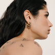 Leopard/Espresso Medium Reversible Sparkle Hoop Earrings on model