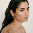 Leopard/Espresso Medium Reversible Sparkle Hoop Earrings on model