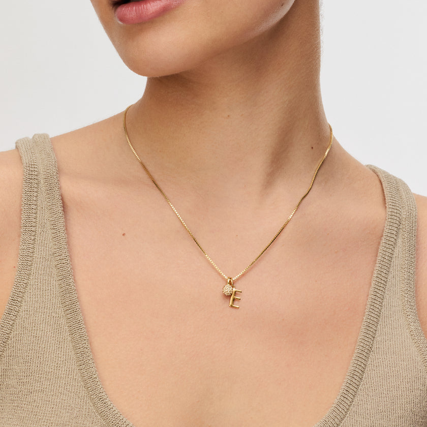 Gold Letter charm with a Gold Mini Sparkle Ball Charm on a Gold Box Chain on model