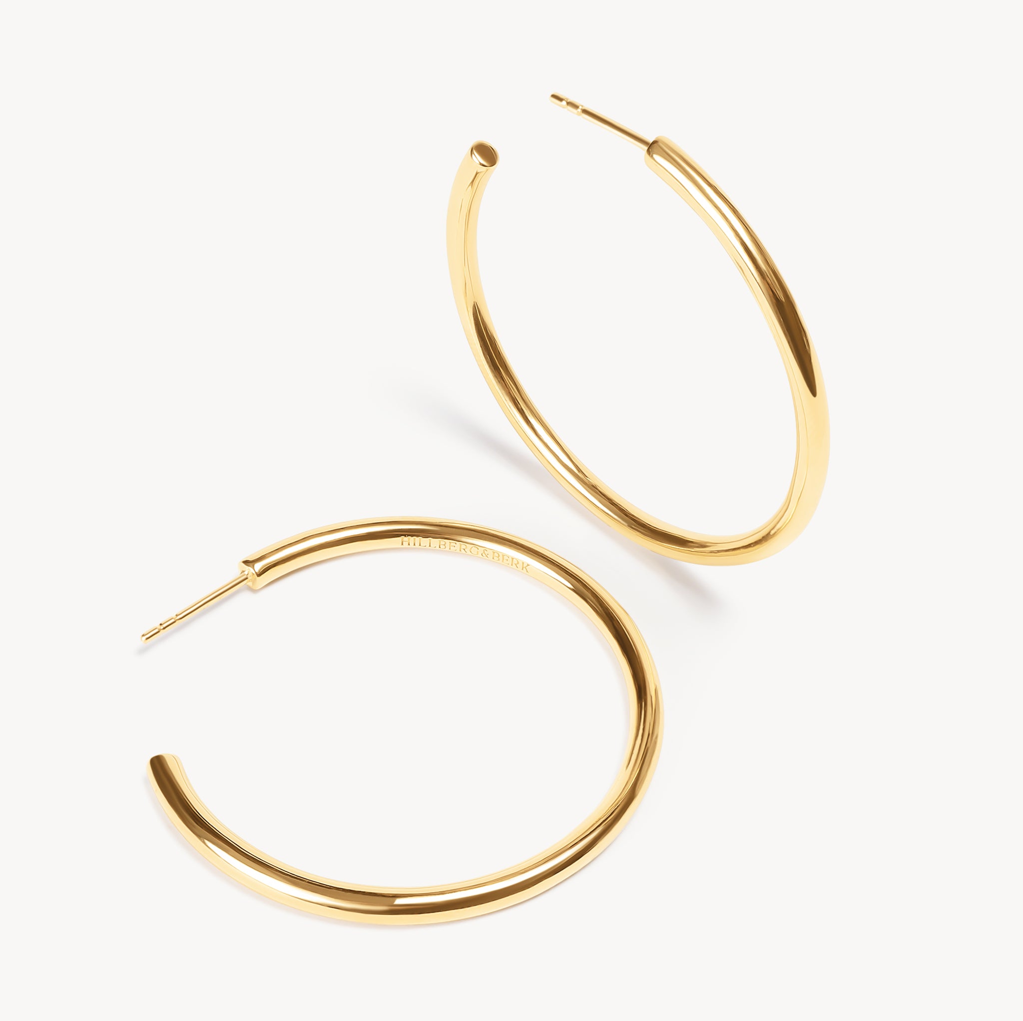 Gold Lightweight Statement Hoop Earrings laying flat