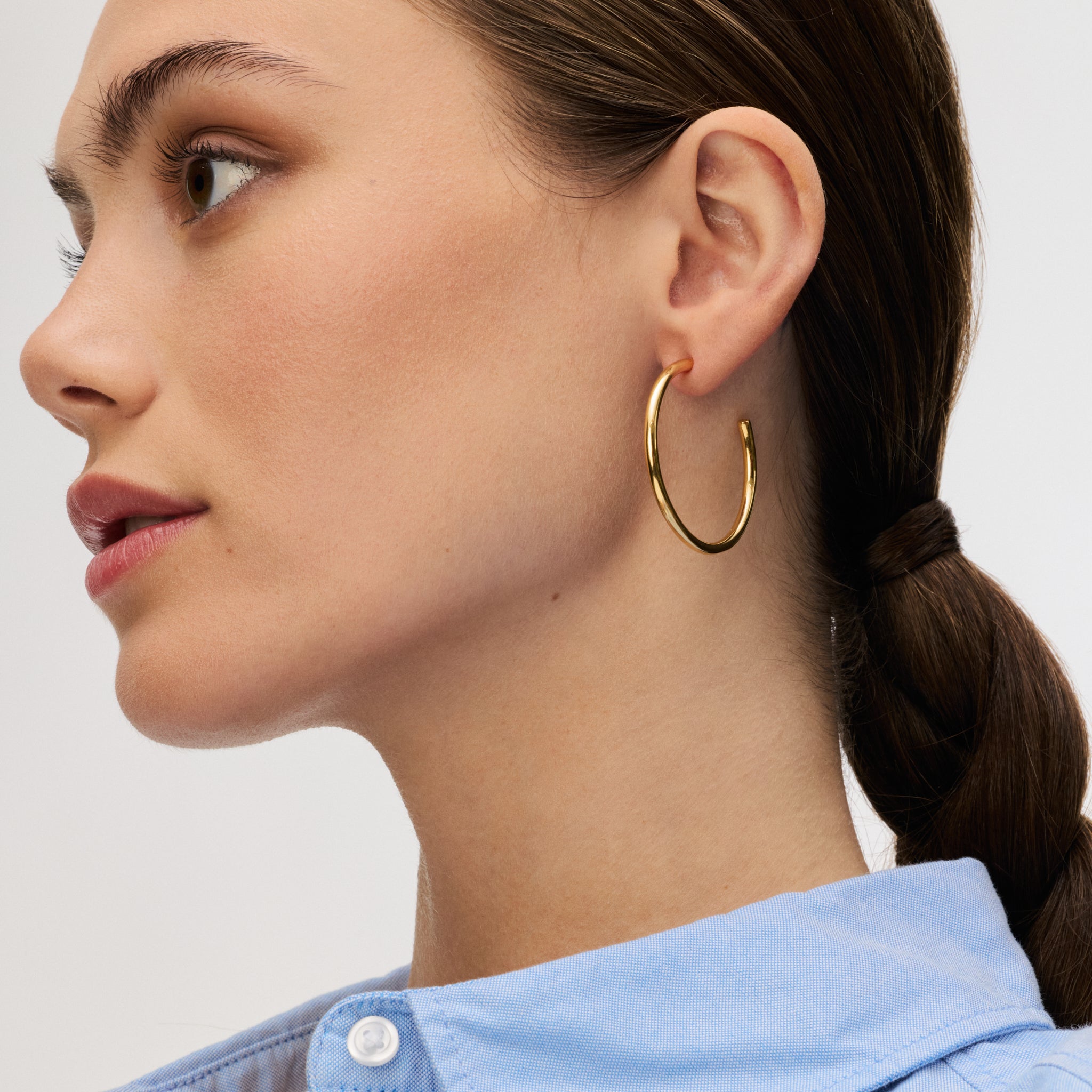 Lightweight Statement Hoop Earrings in gold on model
