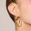 Gold Lightweight Statement Hoop Earrings on model