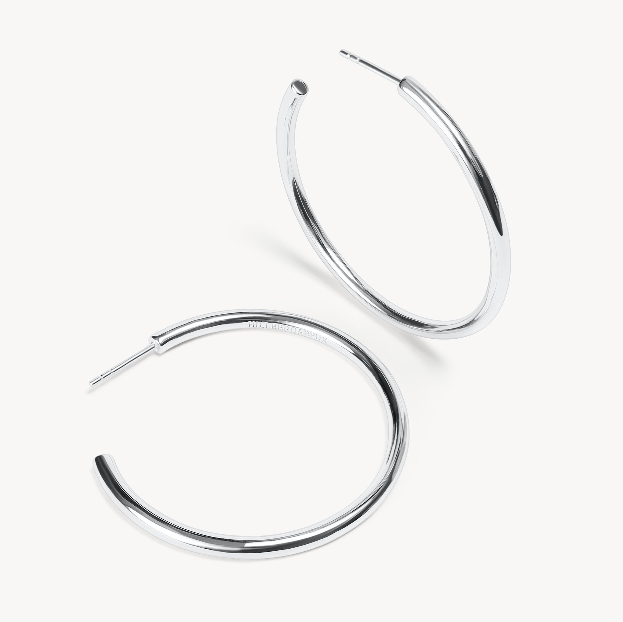 Silver Lightweight Statement Hoop Earrings laying flat