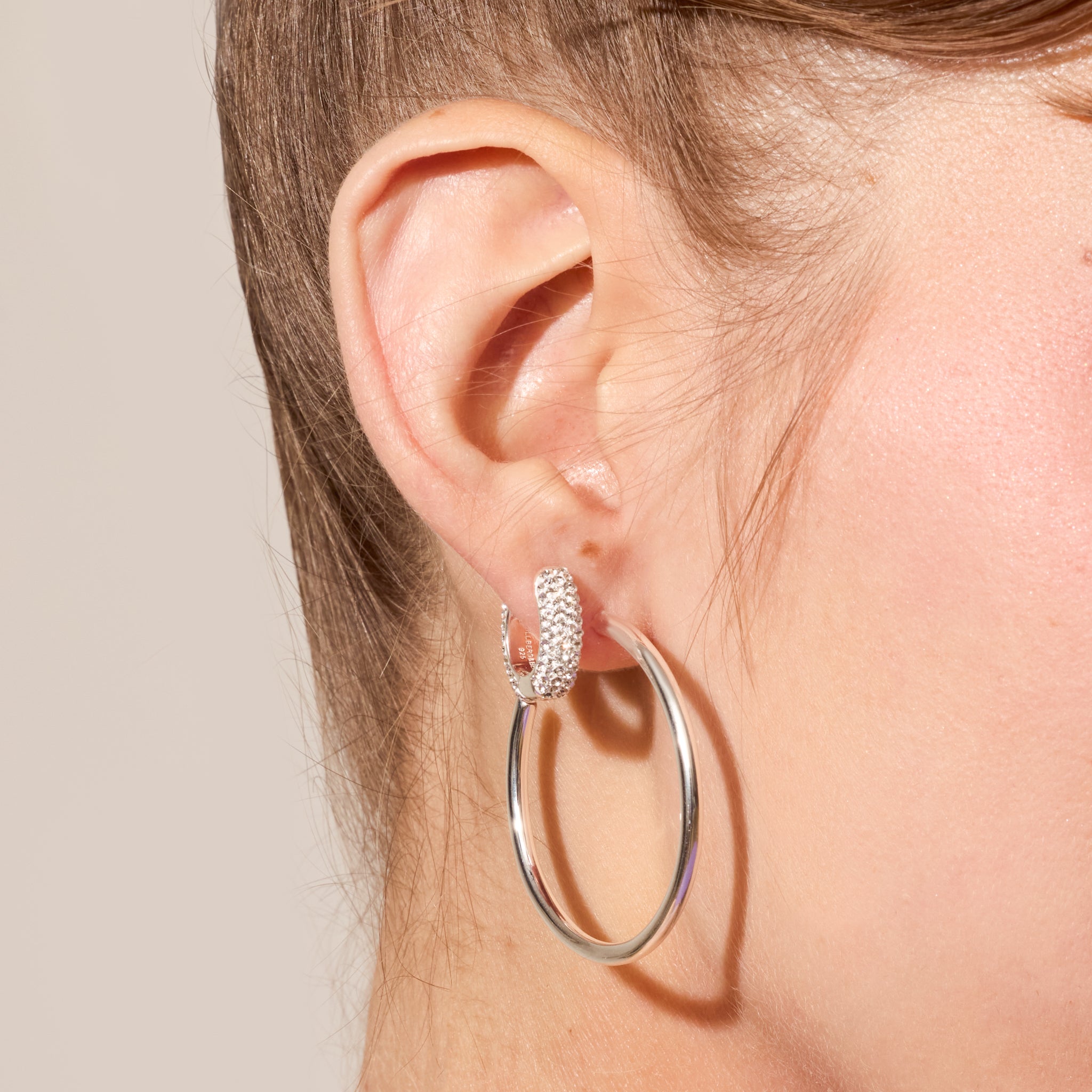 Small White Sparkle Hoop Earrings and Silver Lightweight Statement Hoop Earrings on model