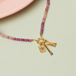 Ace of Hearts Charm, Matchstick Charm, and Love Letter Charm on Warm Gradient Charm Necklace. 