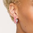 Lovestruck Medium Sparkle Reversible Hoop Earrings on model