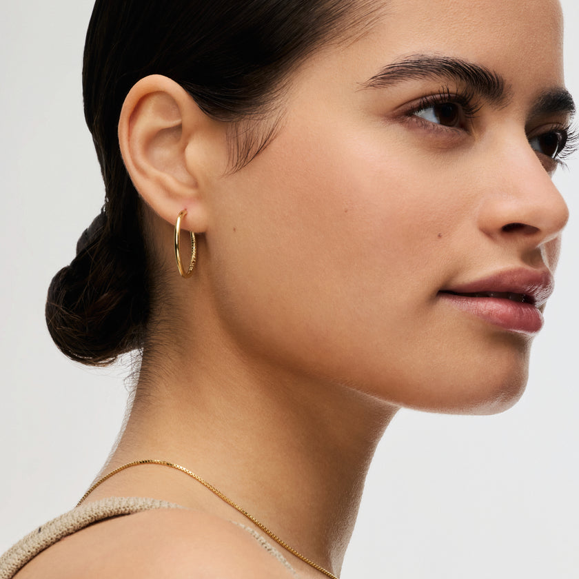 Gold Medium Hoop Earrings on model