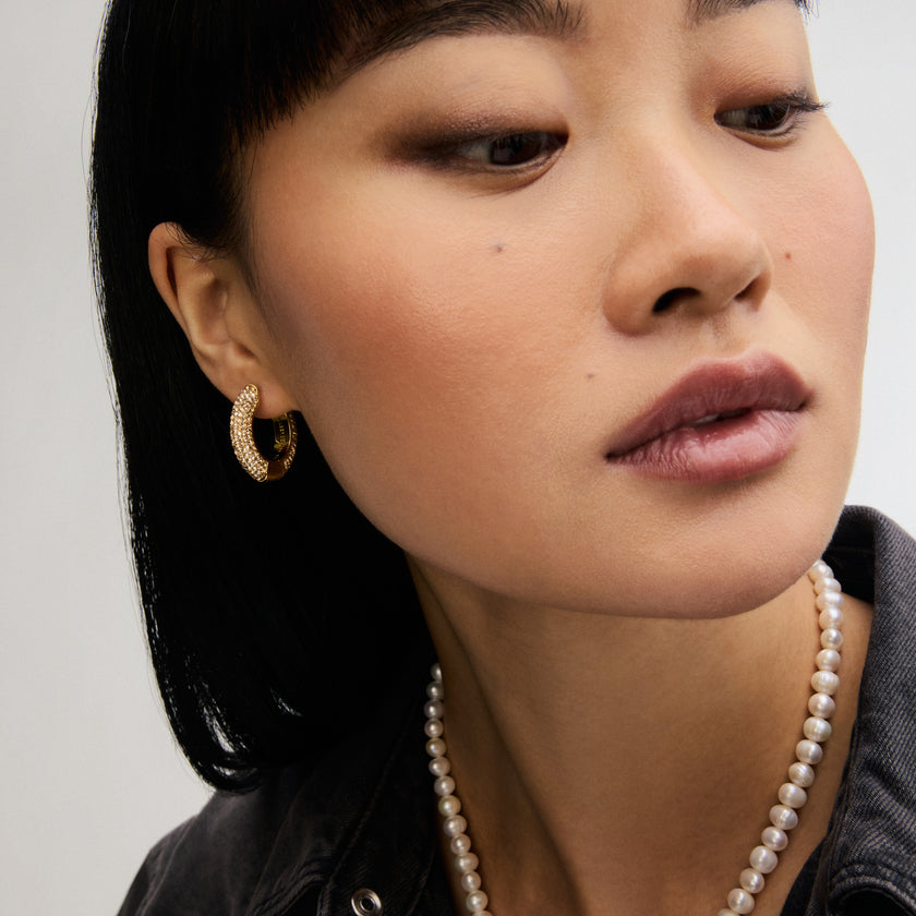 Soft Gold Medium Sparkle Hoop Earrings on model on model