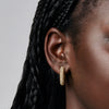 Medium Sparkle Hoop Earrings on model