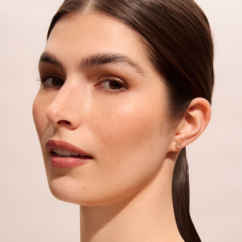 Mini Horseshoe Stud Earrings on model