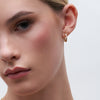 Inside-Out Huggie Hoop Earrings Pink on model