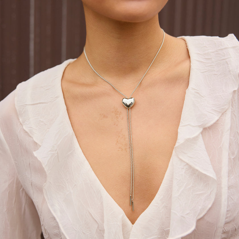 Silver Puffy Heart Bolo Tie on model
