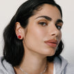 Medium Red Sparkle Ball™ Stud Earrings on model