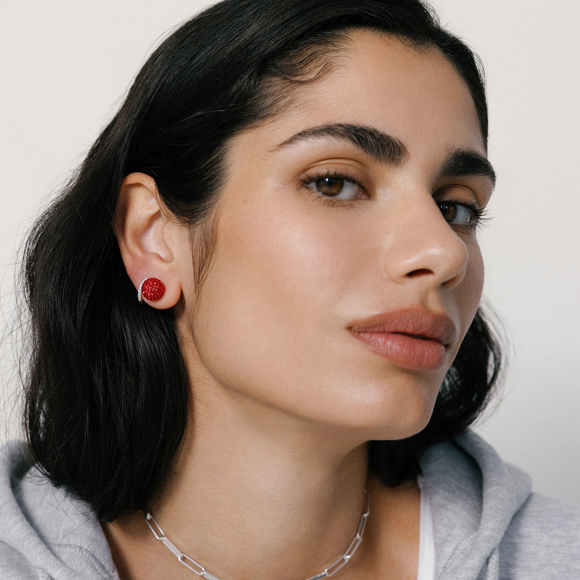 Medium Red Sparkle Ball™ Stud Earrings on model