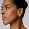 Rose Gold Etched Floral Sparkle Reversible Hoop Earrings on model