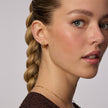 Champagne Starburst Sparkle Reversible Hoop Earrings on model