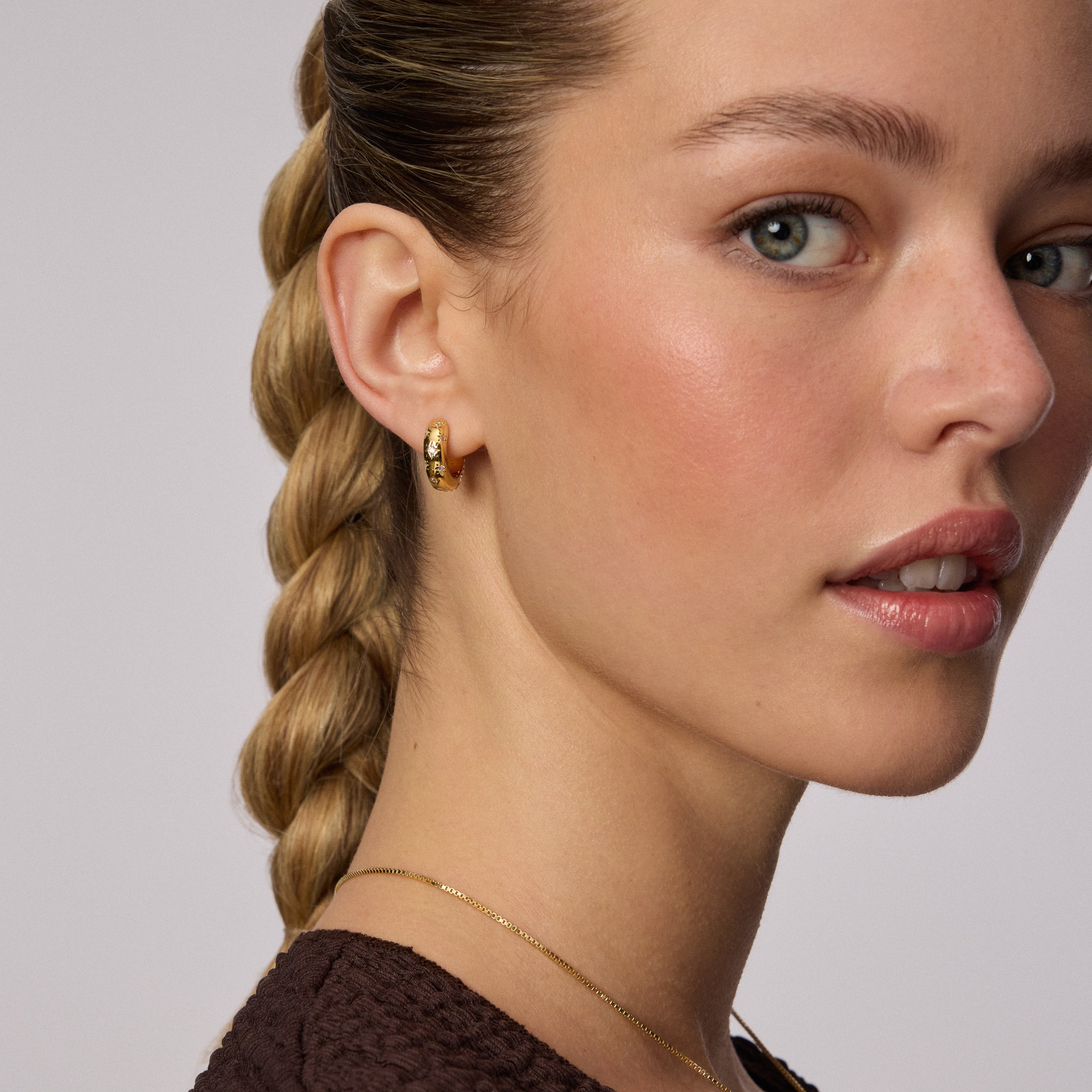 Champagne Starburst Sparkle Reversible Hoop Earrings on model
